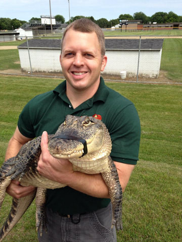 Man holding a Crocodile